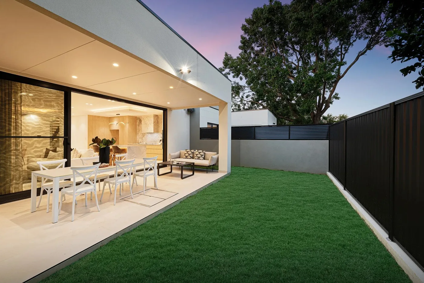 Aluminium sliding stacker doors opening to an alfresco area on a Sydney home