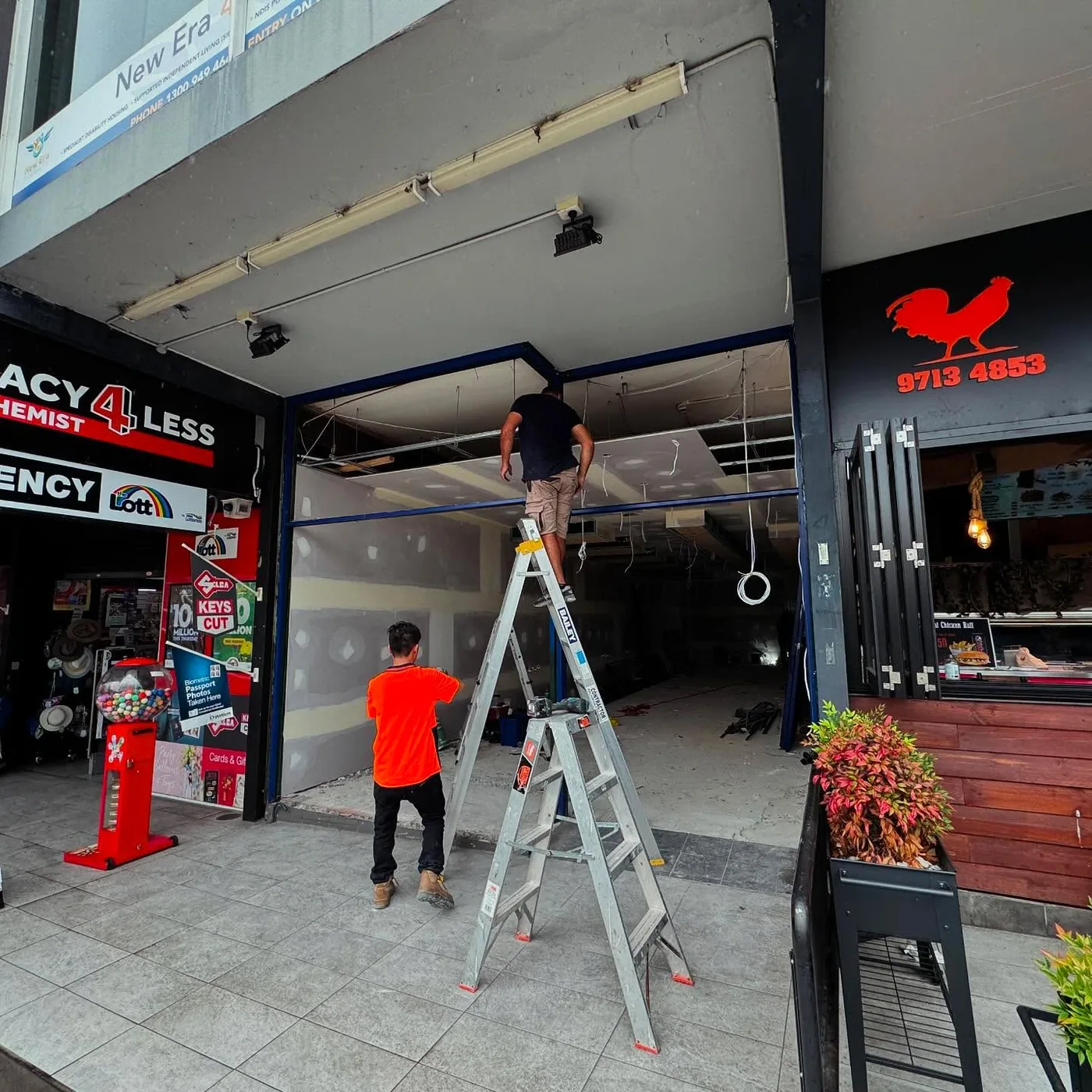 Aluminium shopfront glazing being installed on a Sydney commercial premises